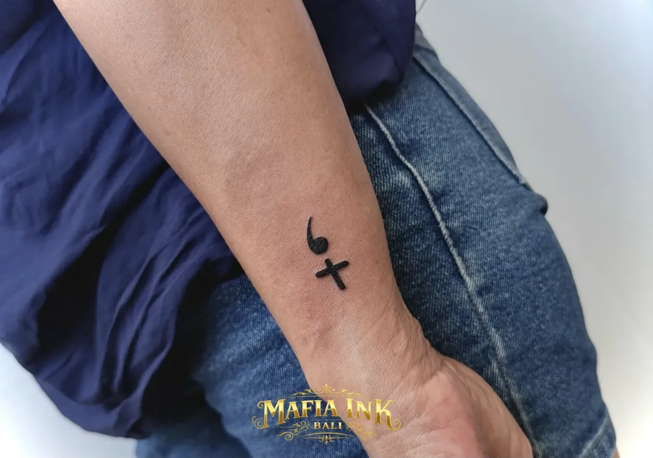 A small symbol tattoo by The Mafia Ink Bali