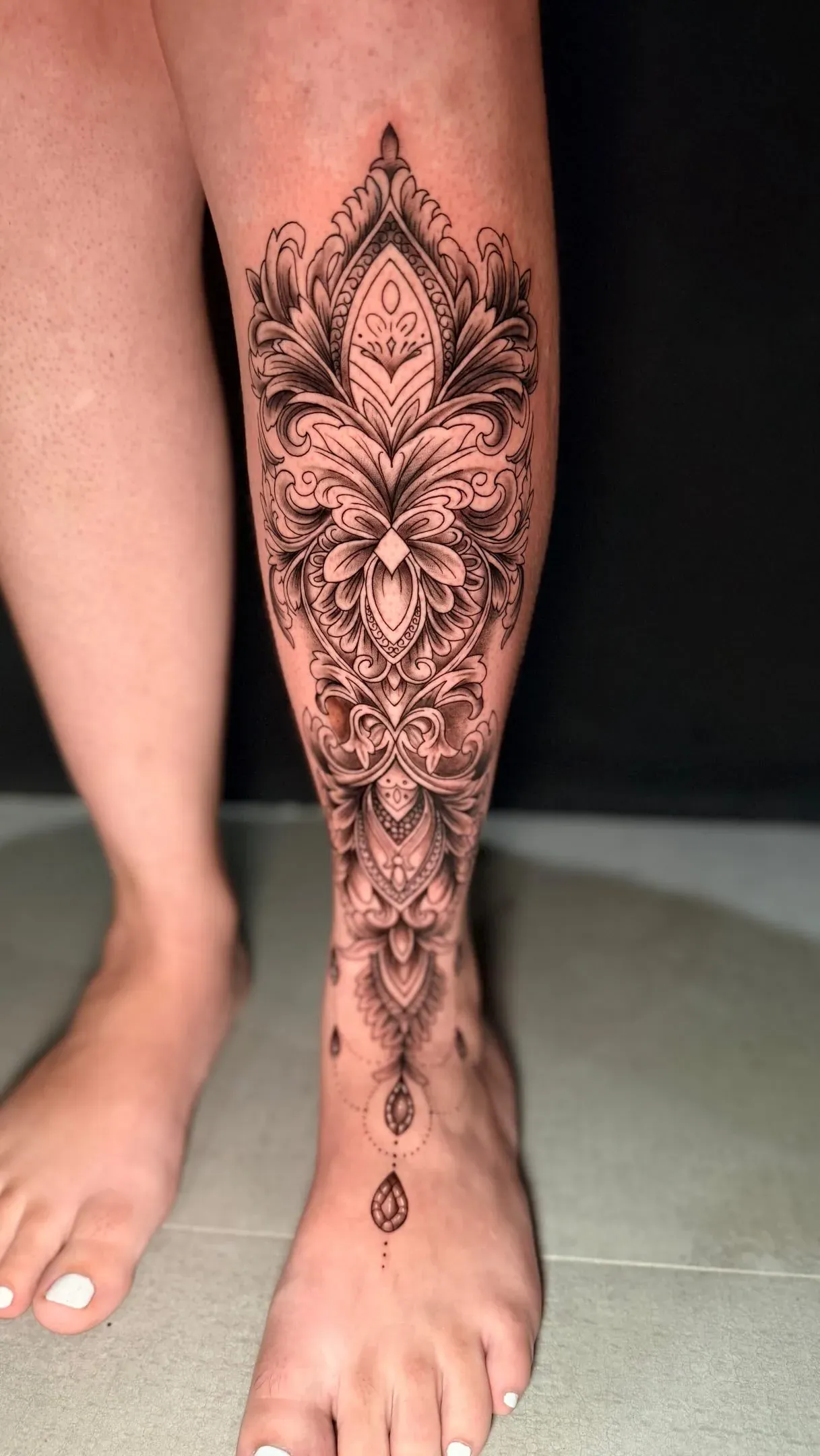 Ornamental leg detail tattoo by The Mafia Ink Bali
