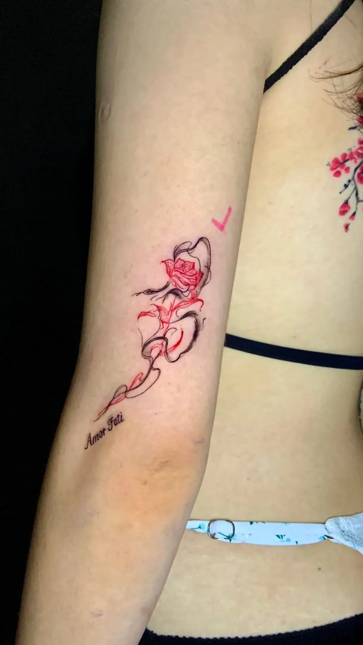 A touch of red tattoo by The Mafia Ink Bali