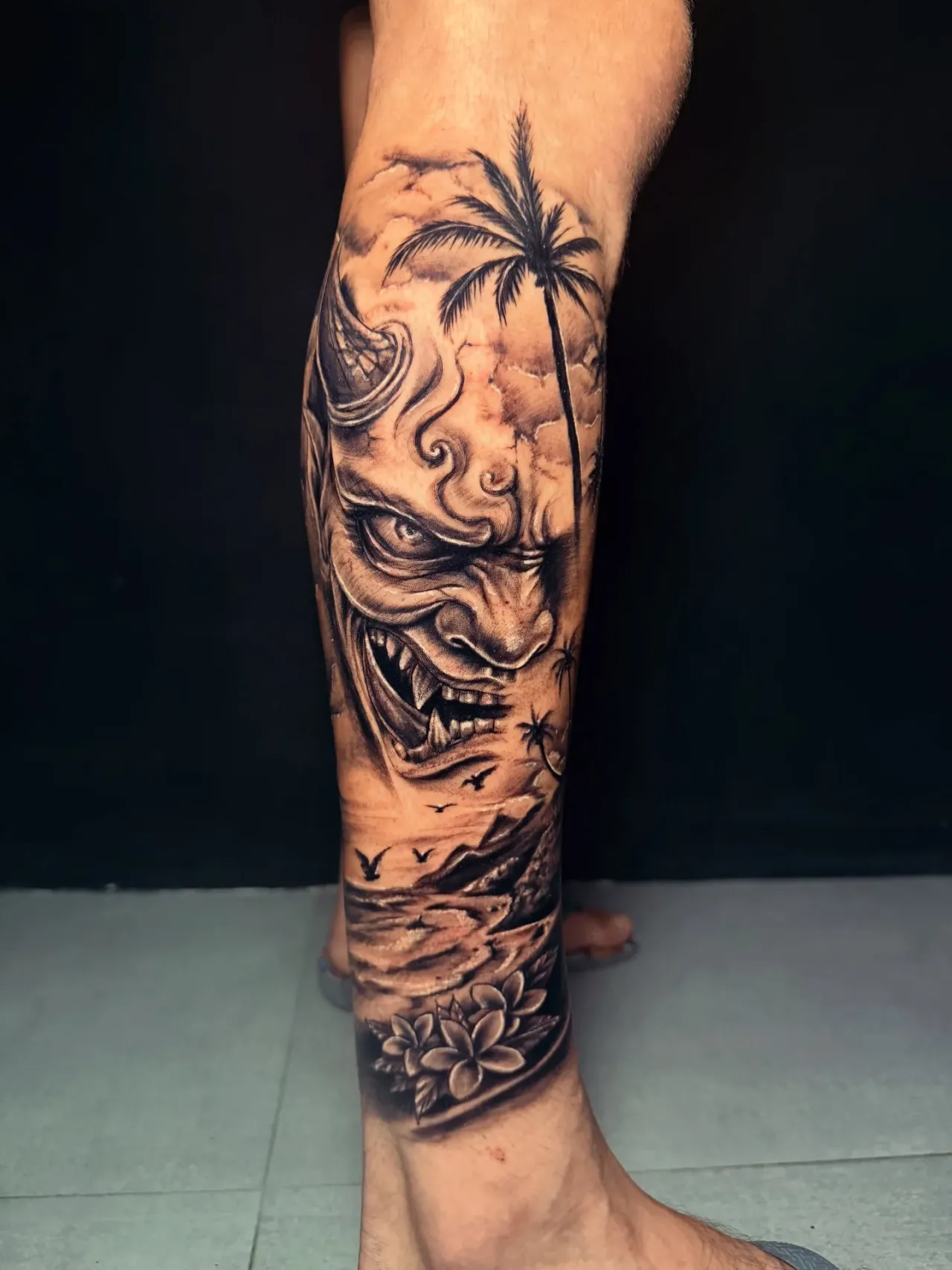 Japanese mask leg piece tattoo by The Mafia Ink Bali