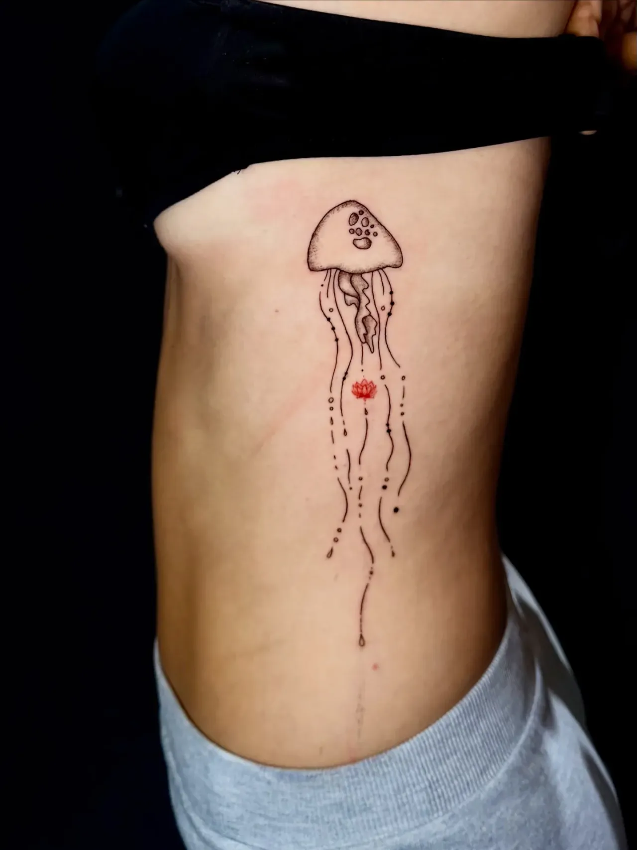 Jellyfish in fine lines tattoo by The Mafia Ink Bali