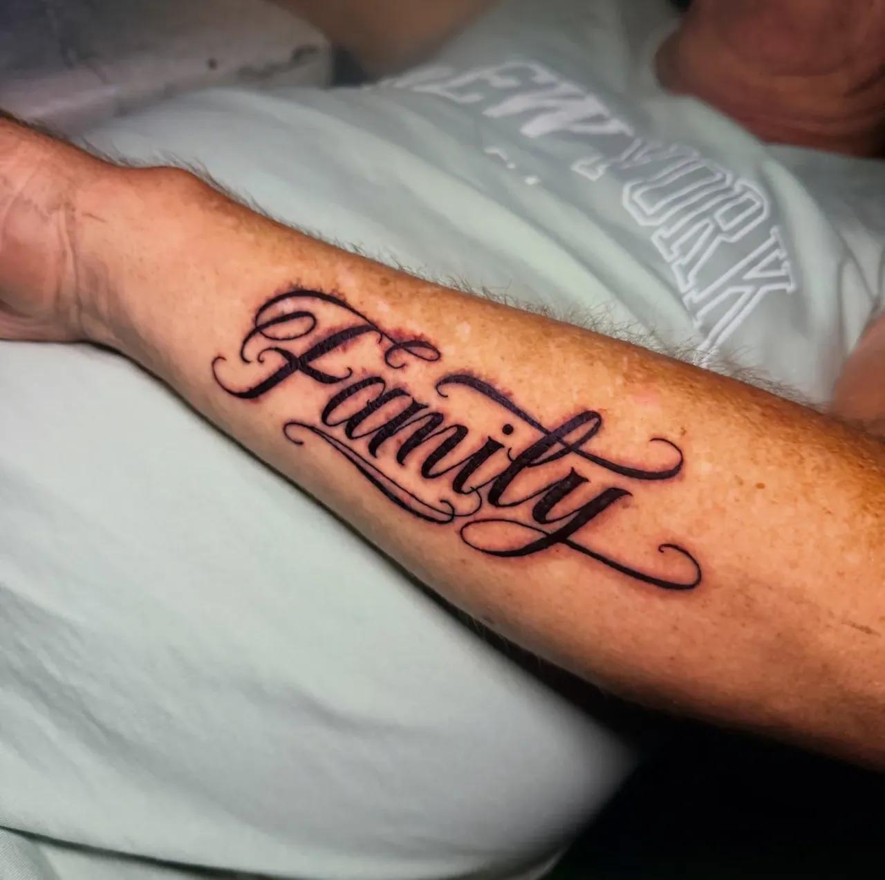 Family lettering tattoo by The Mafia Ink Bali