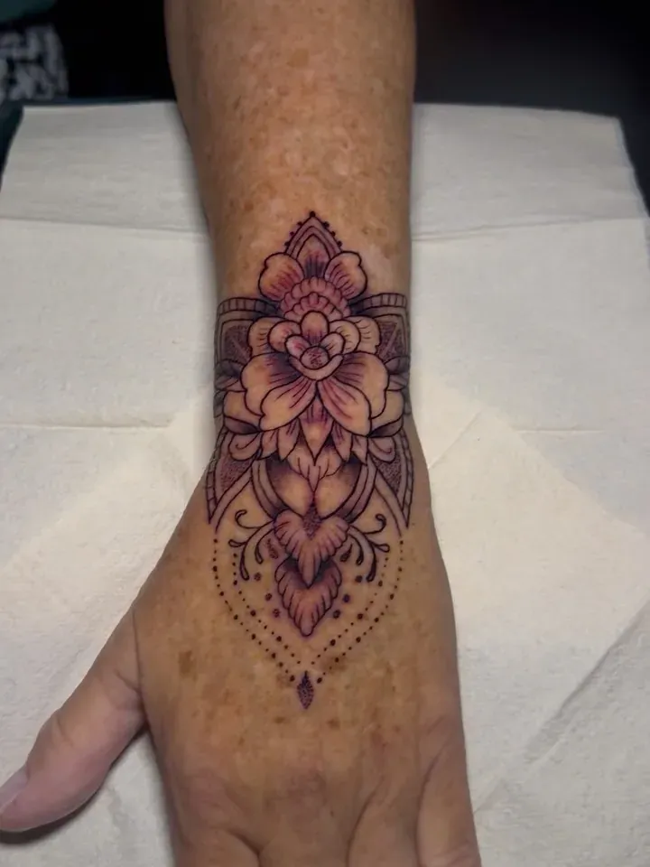 Floral hand tattoo tattoo by The Mafia Ink Bali
