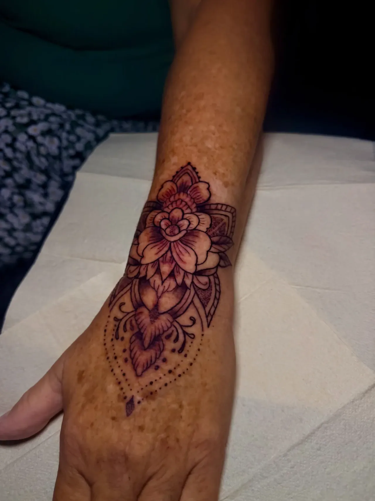 Floral hand tattoo — side view tattoo by The Mafia Ink Bali