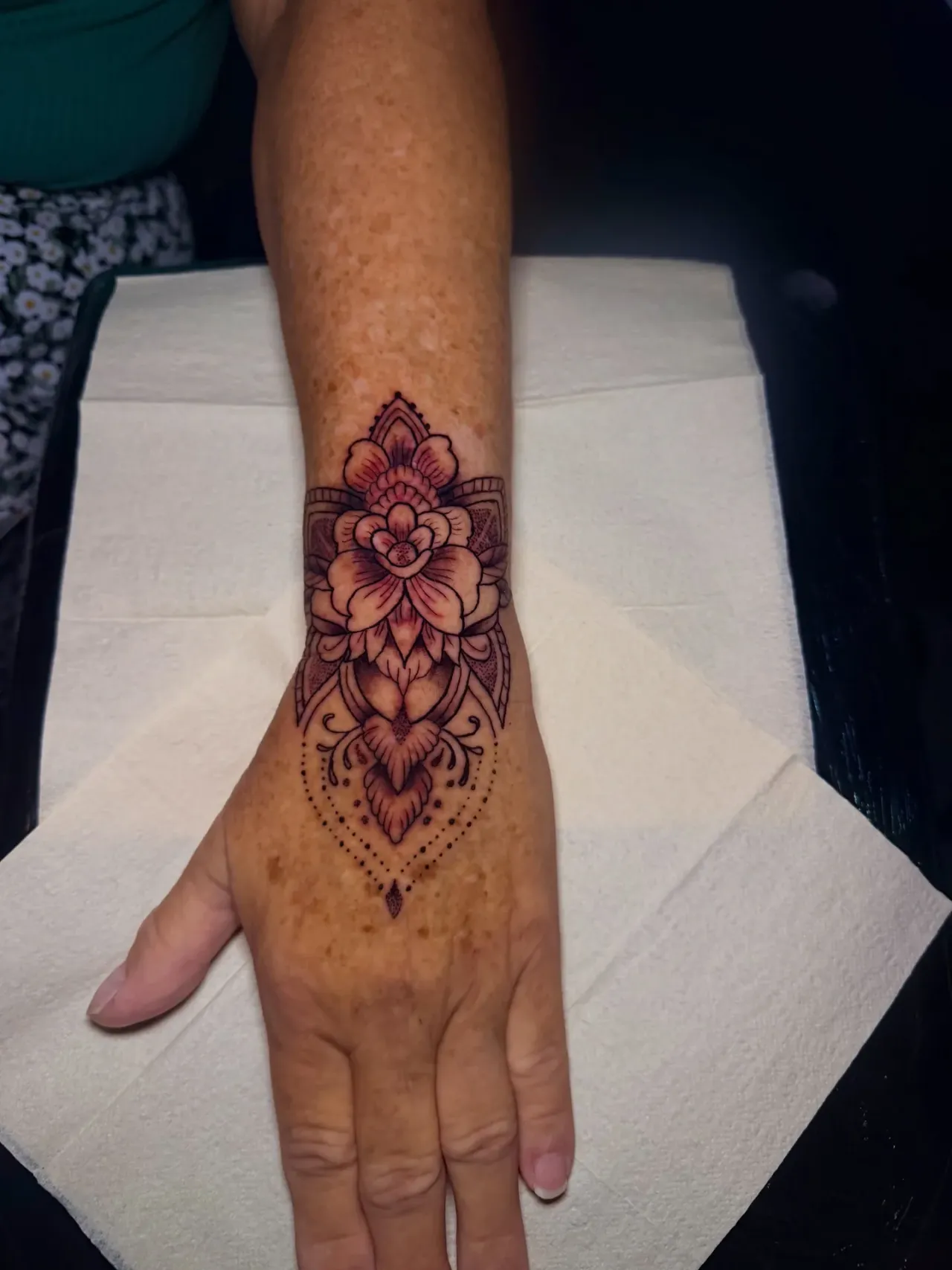 Floral hand tattoo — another view tattoo by The Mafia Ink Bali