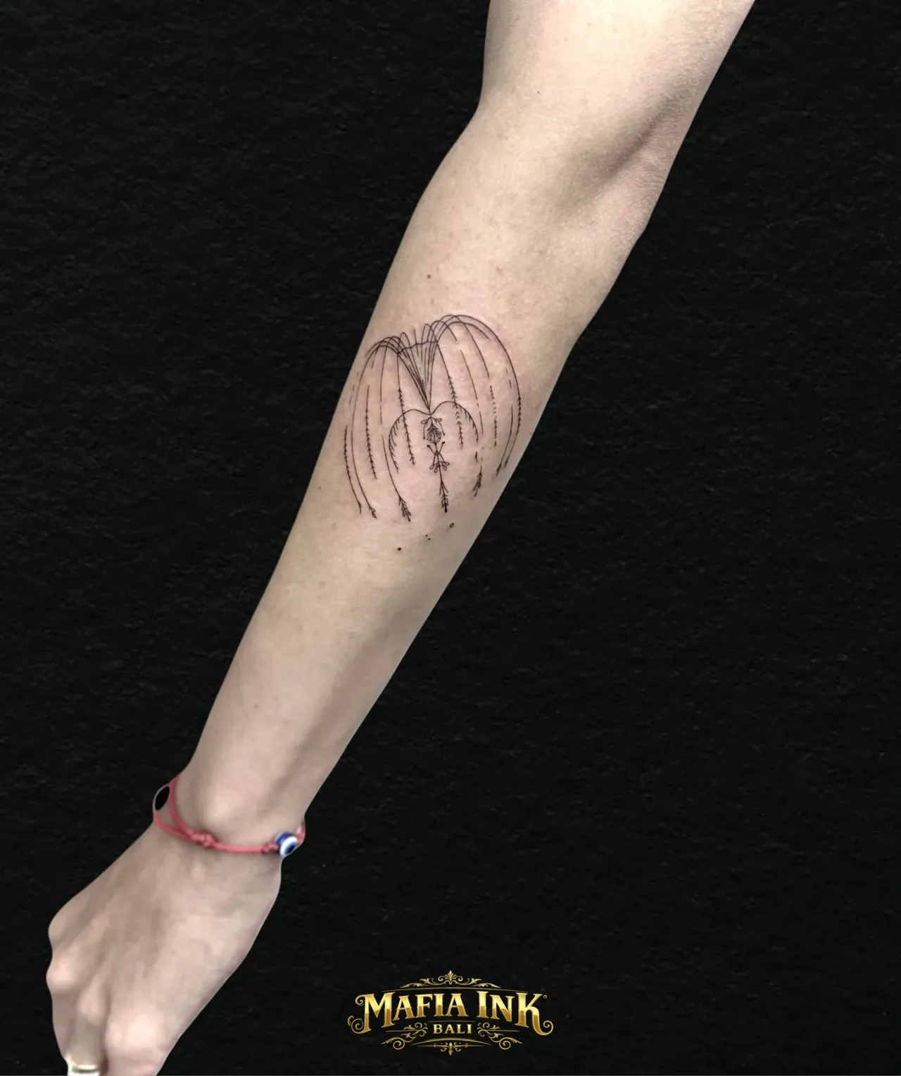 Fine-line face outline tattoo by The Mafia Ink Bali